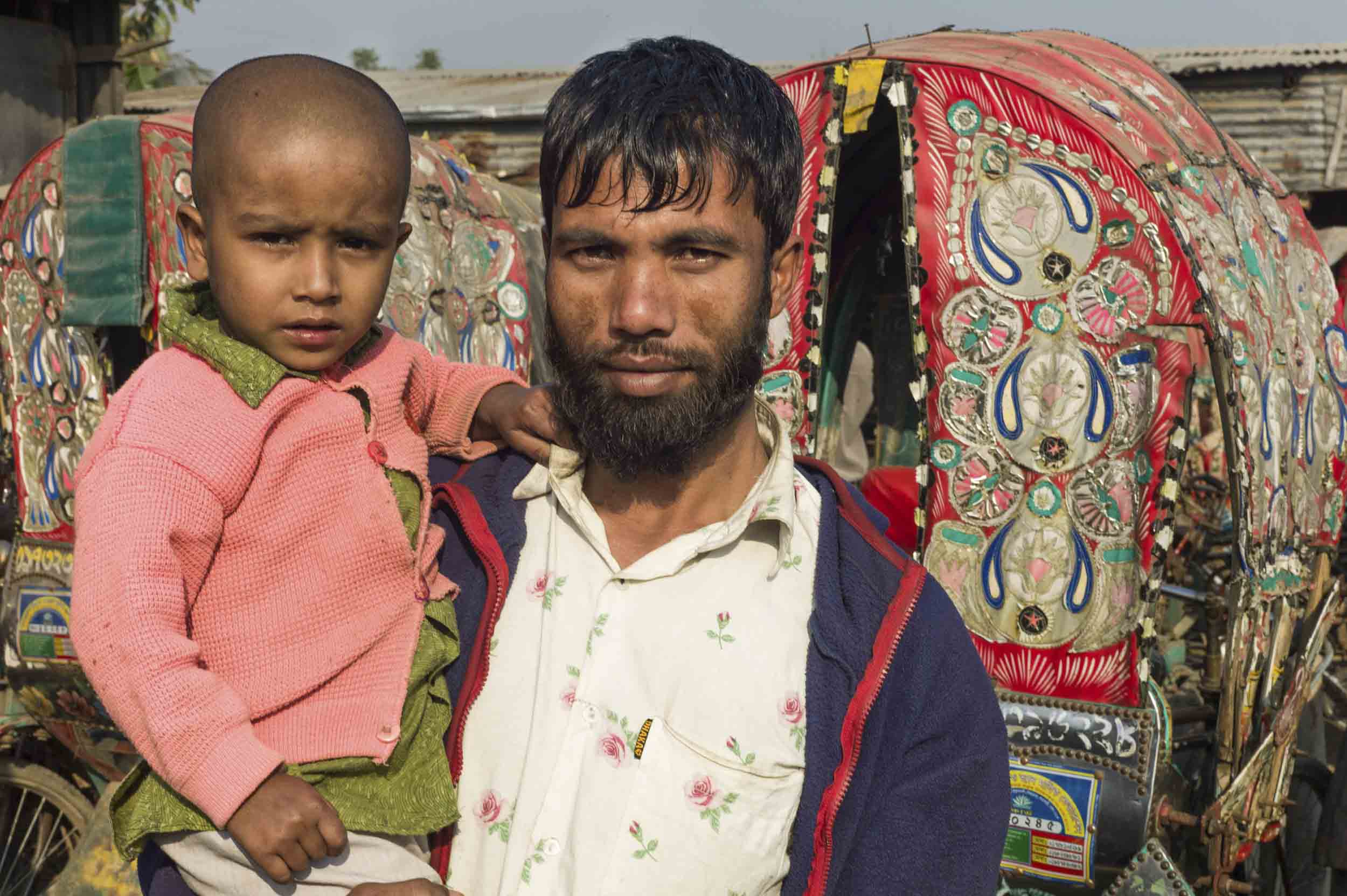 A rickshaw driver at his livery in a Dhaka slum, 2012