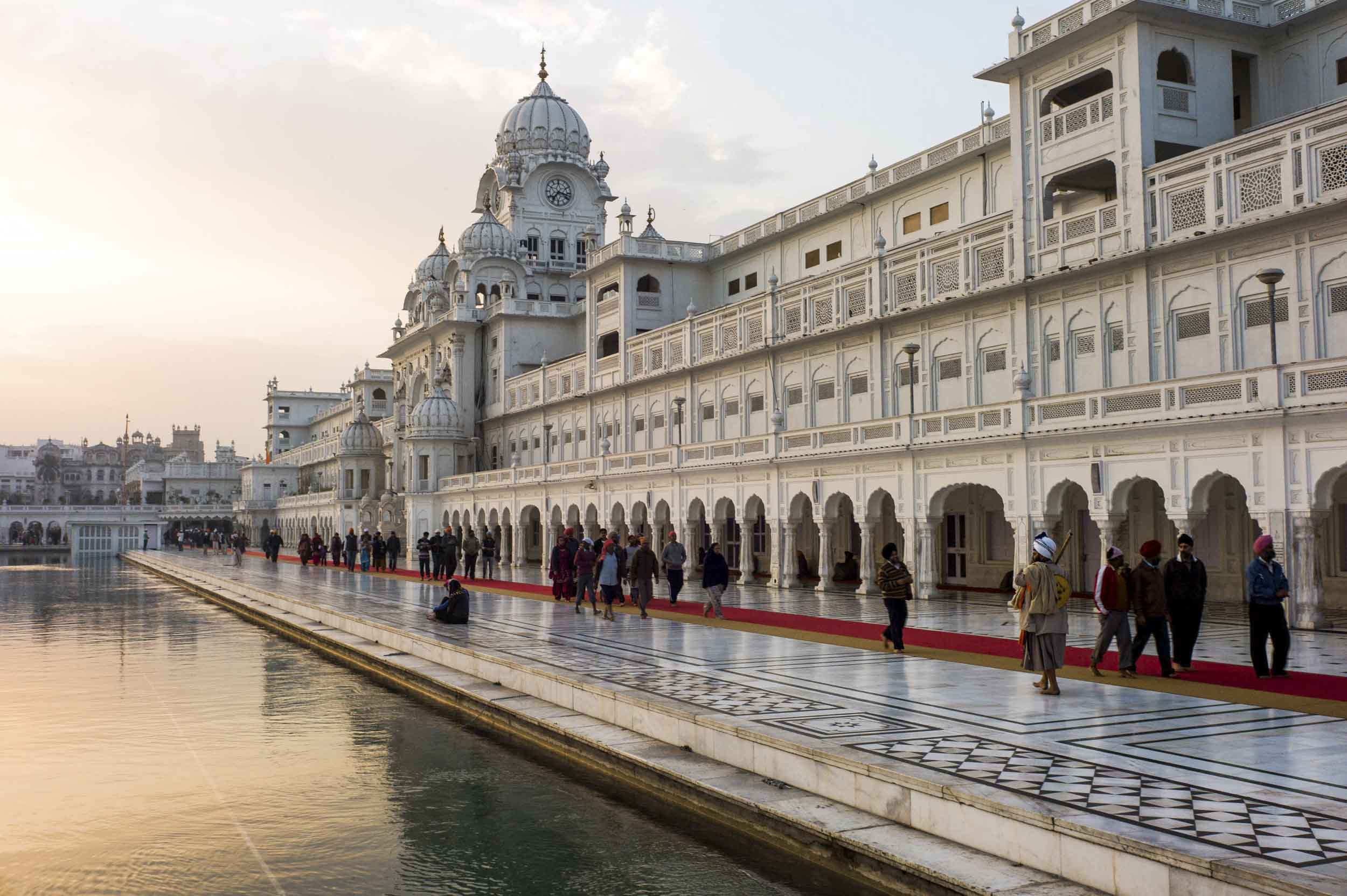 Ornate buildings surround the reflecting pool at the Golden Temple, the Sikh faith’s holiest site. Amritsar, Punjab, India, 2012