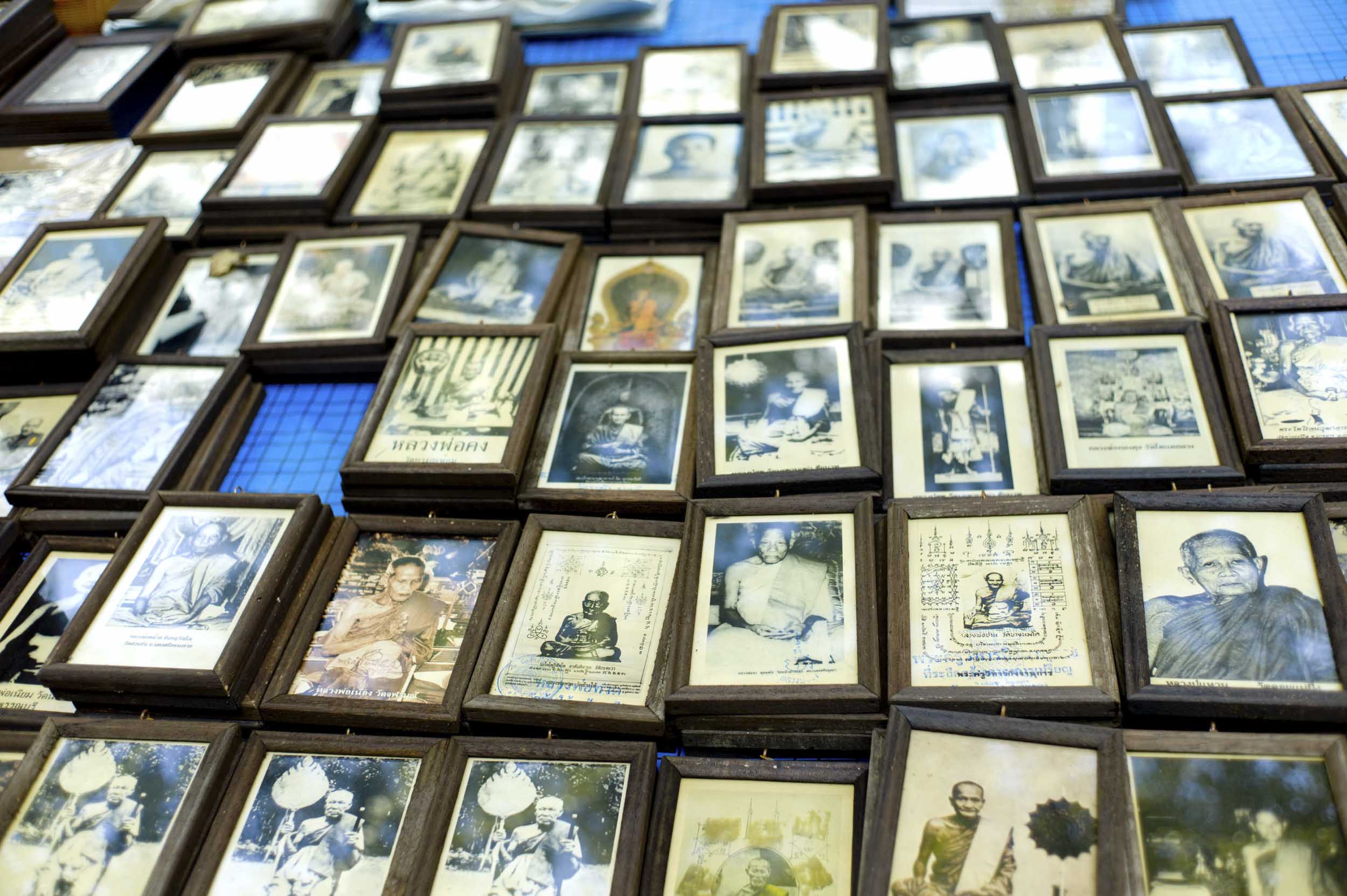 Framed photos of revered monks in central Bangkok, Thailand, 2011