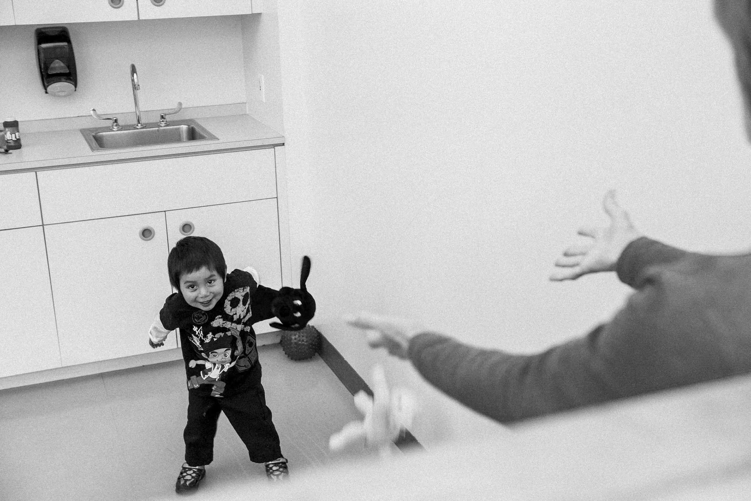 A young boy plays during a behavioral therapy session