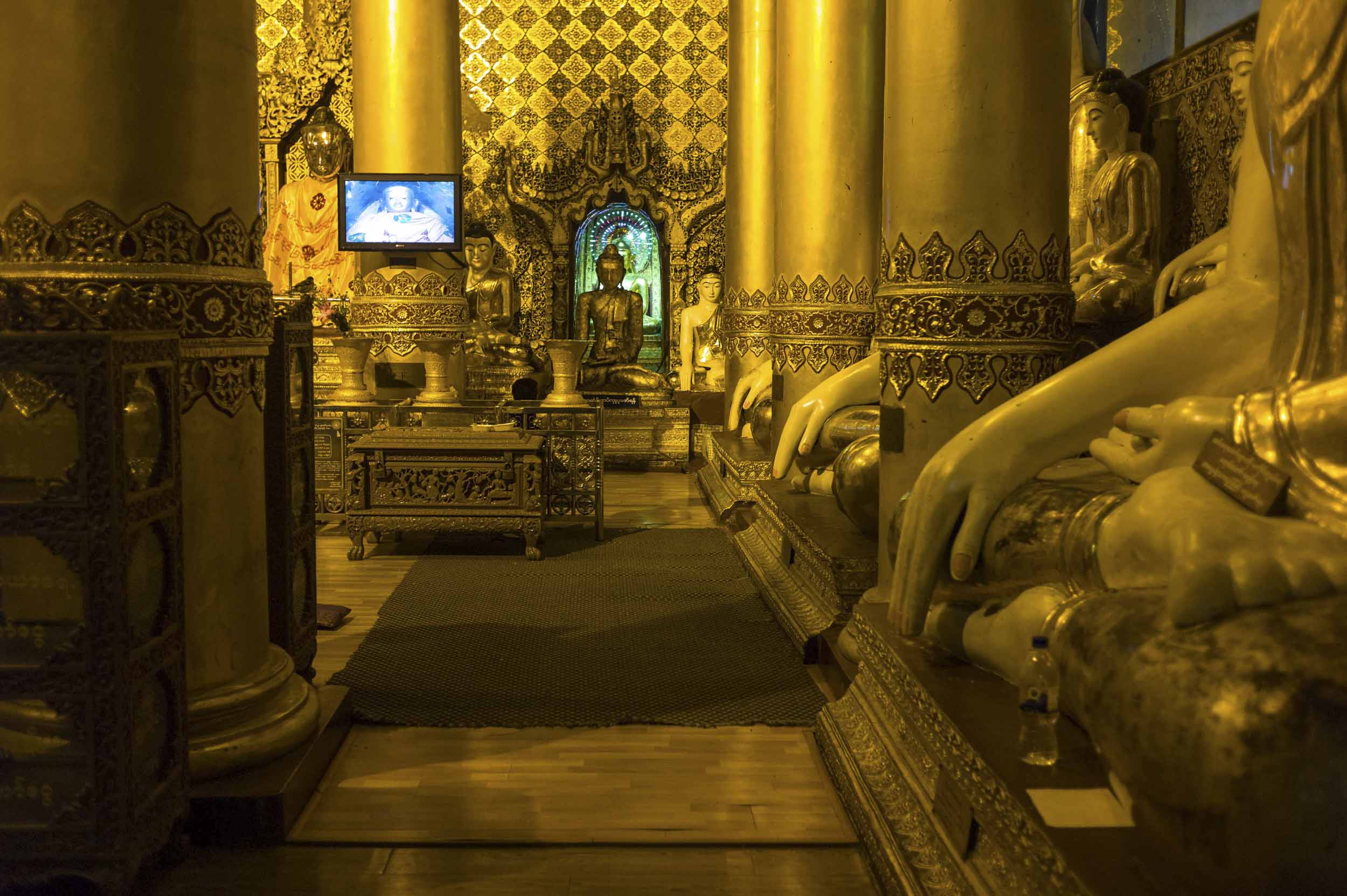 Gilt Buddha statues in Yangon’s Shwedagon Paya, a gold covered stupa with a jewel crested tip and Myanmar’s most sacred Buddhist site, 2012